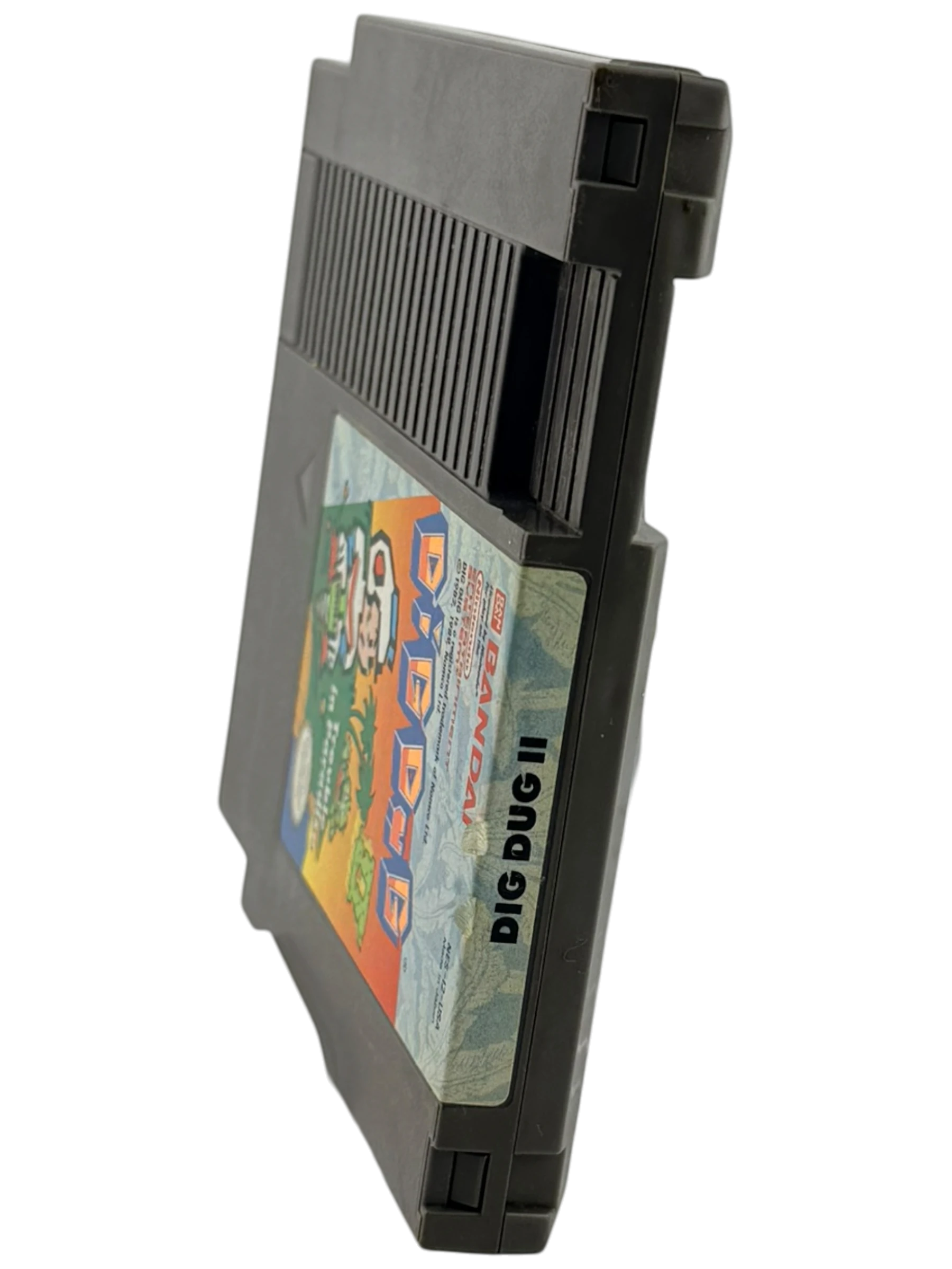 Coolection Dig Dug II: Trouble in Paradise NES cartridge. Loose copy, tested and functional. Features retro gameplay.