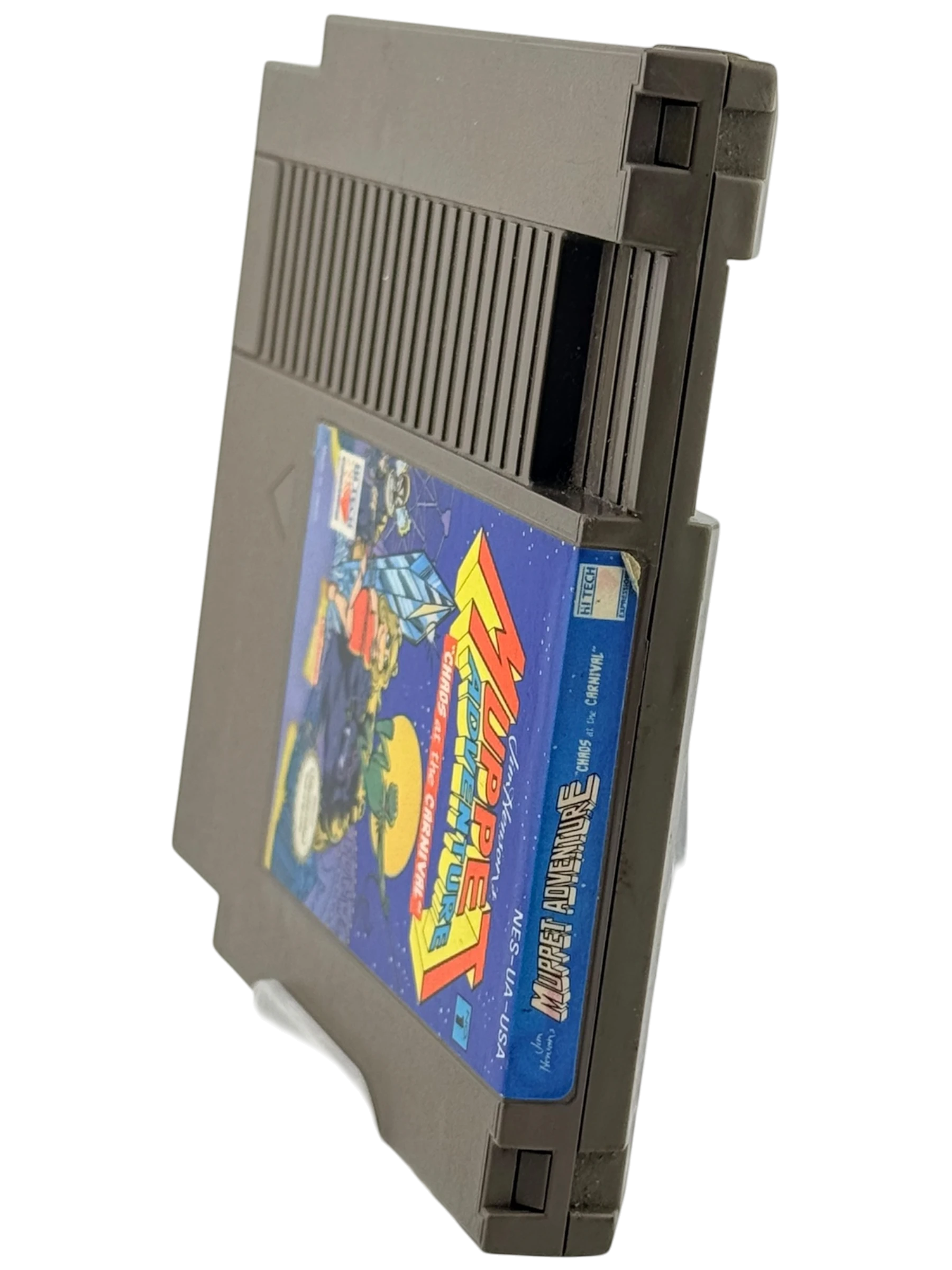 Coolection Muppet Adventure: Chaos at the Carnival NES cartridge. Gray plastic with colorful label featuring Muppet characters.