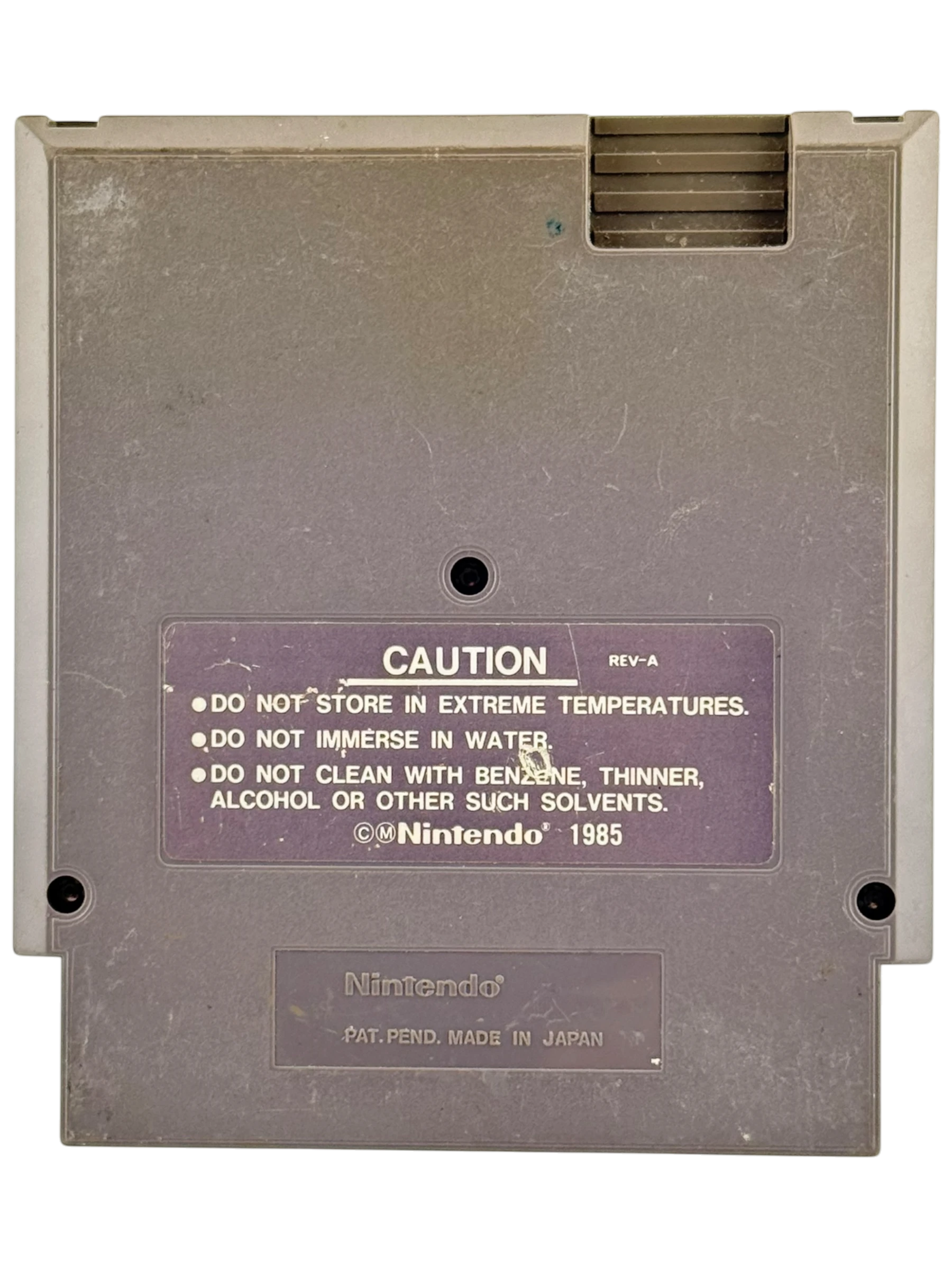 Coolection Muppet Adventure Chaos at the Carnival NES cartridge, gray plastic with caution label.