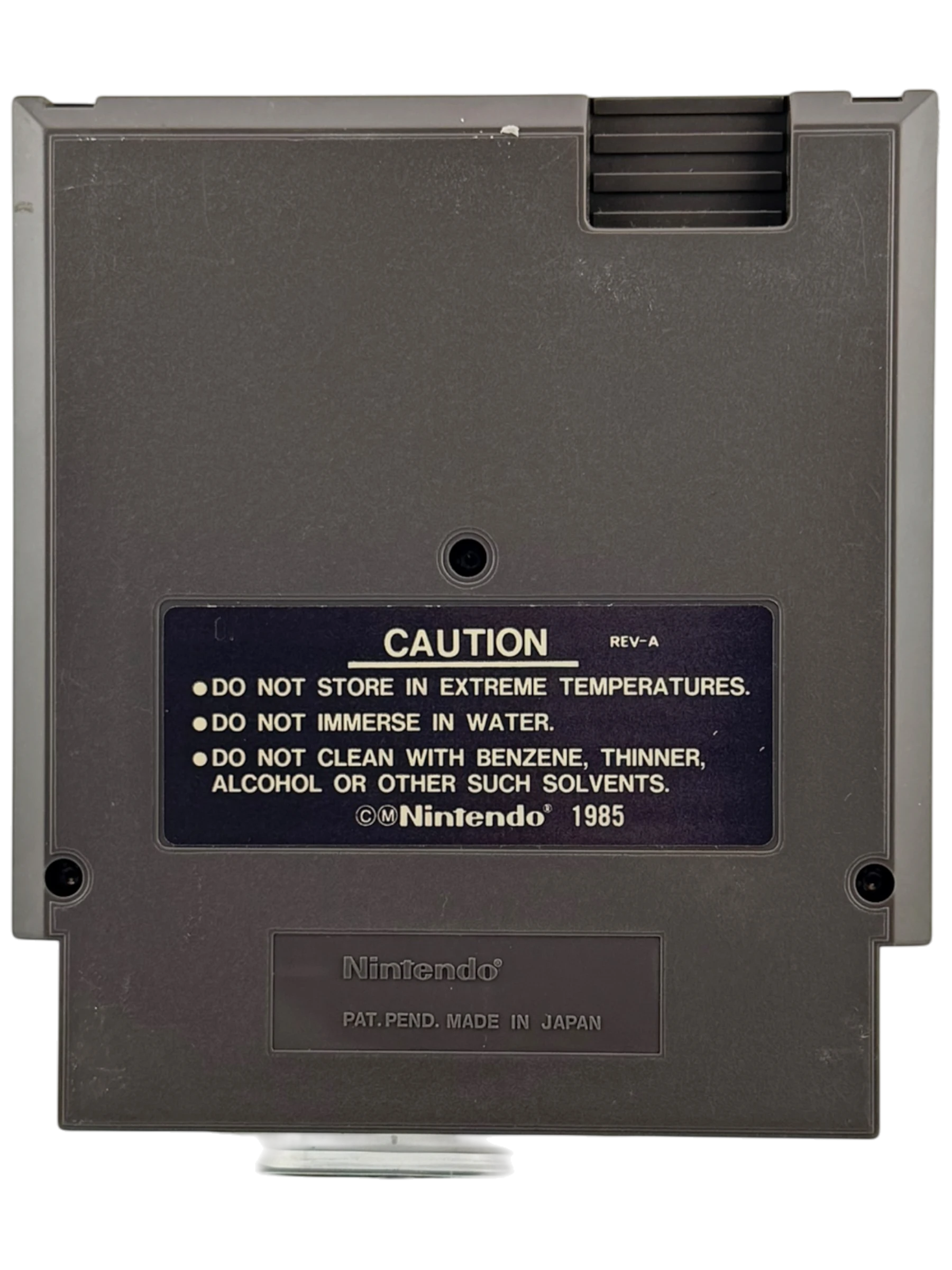Coolection Nintendo NES Dig Dug II: Trouble in Paradise game cartridge, gray plastic with caution label.
